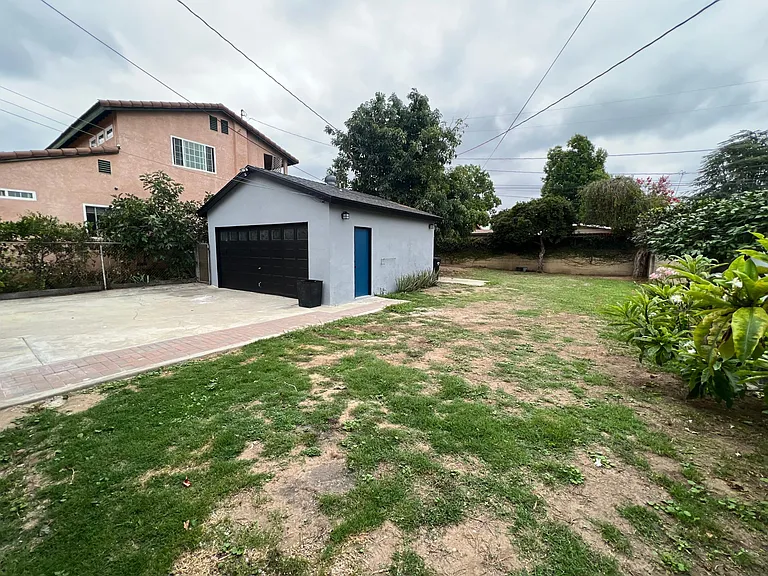 Huge enclosed yard, long driveway, full 2 car garage. Washer & dryer included in garage.