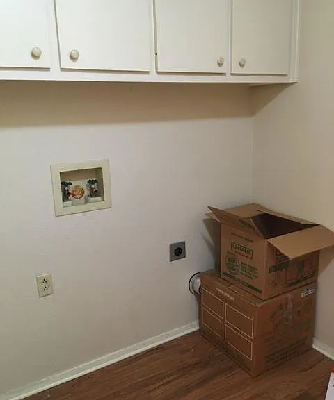Laundry hook-ups in unit, with great storage above