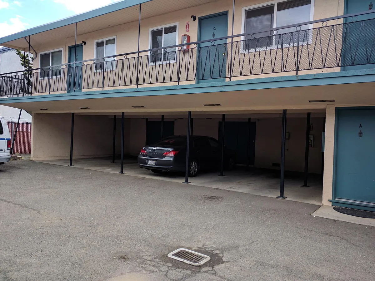 Side of the building with carports and Storage area. It is an upstairs unit with no neighbors underneath. - 139 Williams St #C