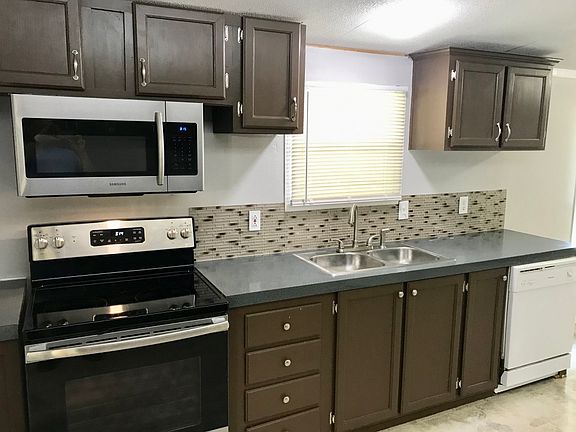 kitchen stove, microwave, sink, dishwasher