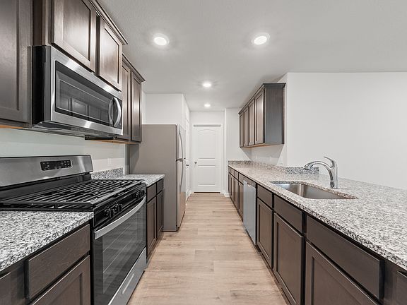 The kitchen of the Cedar has energy-efficient appliances.