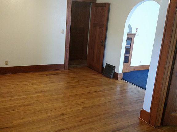 large living room with hardwood floor