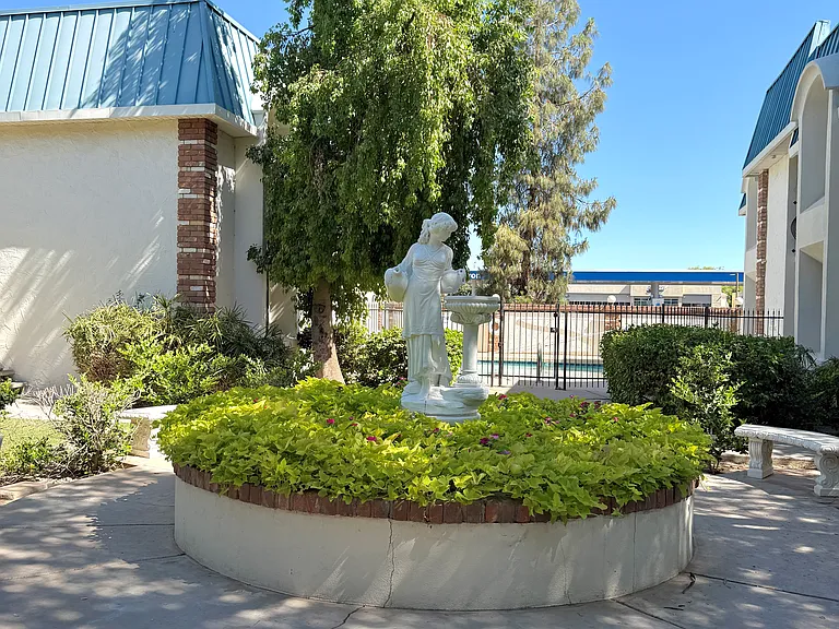 Courtyard, greenery and statue view