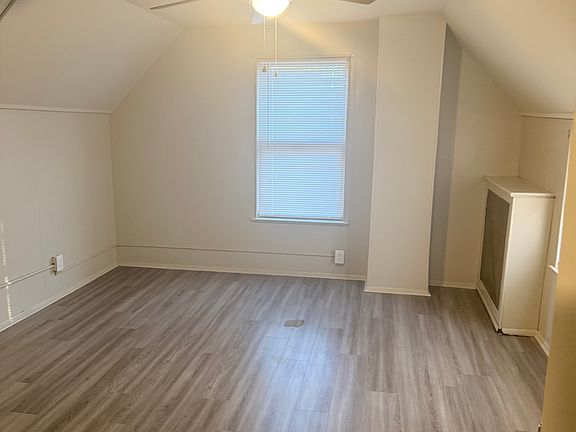 dining room with three windows overlooking the backyard