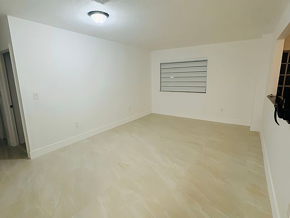 New tile flooring throughout and window shades