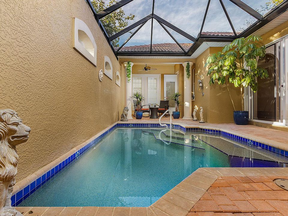 Caged in completely private pool, with fountain, and heated.