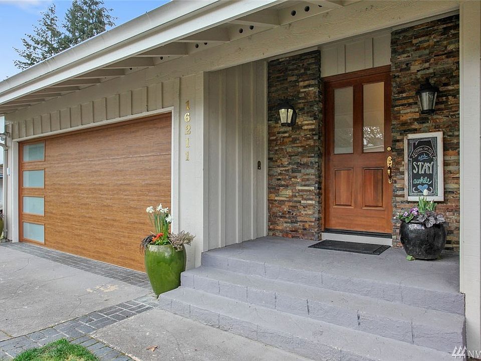 Welcome home to Fairwood Greens. This spacious 4 bedroom, 2 bath rambler is guaranteed to impress with its curb appeal, luxury finishes and quiet setting. Immaculate and open, this home is perfect for entertaining. Enjoy lush carpet, Italian tile and hardwood floors, expansive walls of windows and soaring vaulted ceilings. Gather in the chef's dream kitchen while you enjoy high-end features, including a Viking 6-burner gas stove and double ovens! The master suite features a gorgeous ensuite bath and a private deck. The front bedroom also makes a great den and has a slider out to a fabulous covered patio area. Extend your gatherings outside to the entertainment sized deck with privacy fence, and enjoy watching all of the surprises waiting to bloom this spring in the professionally landscaped perennial garden. Just a short stroll to Fairwood's favorite--Allen Park with a play structure, basket ball and concerts in the park.