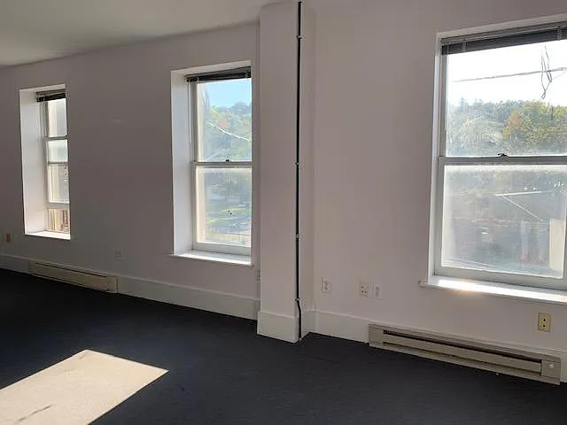 Enter in light-filled living/dining room