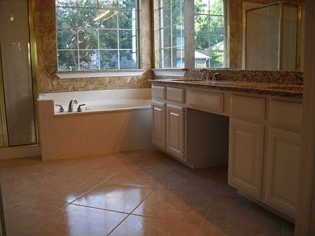 Mstr Bath with Granite Tops, new brushed nickel fixtures and 17" tile