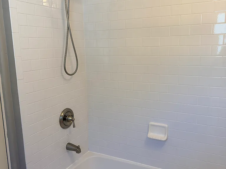 Bathroom has recently updated shower/tub, sink, and toilet, carefully maintained and very clean