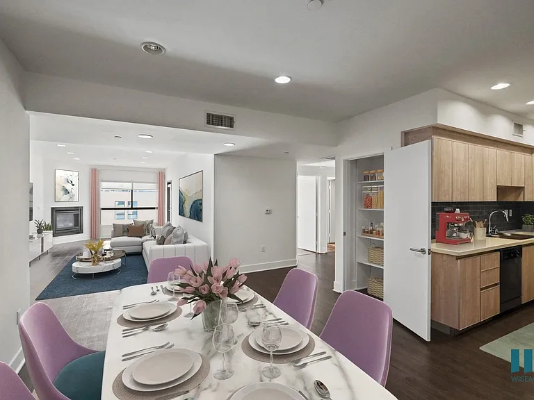 Open-Concept Kitchen, Dining, and Living Room with Hall Closet with Shelving