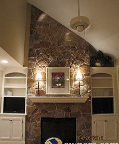 CUSTOM BUILT-IN BACKLIT SHLEVES WITH ENTERTAINMENT CABINETS