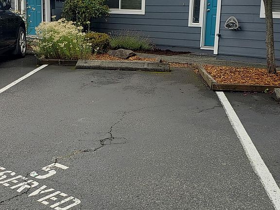 Numbered Parking spot in front of condo.