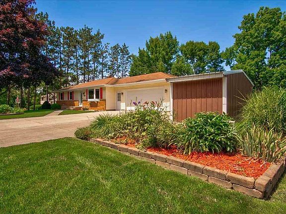 Perennials all around in this beautifully landscaped yard
