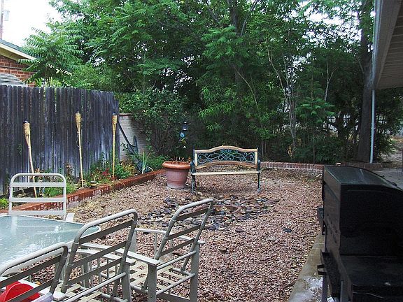 Side yard with fire pit.