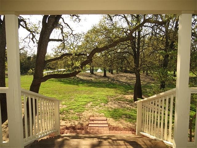On back porch looking out to 1 of 2 ponds on property.