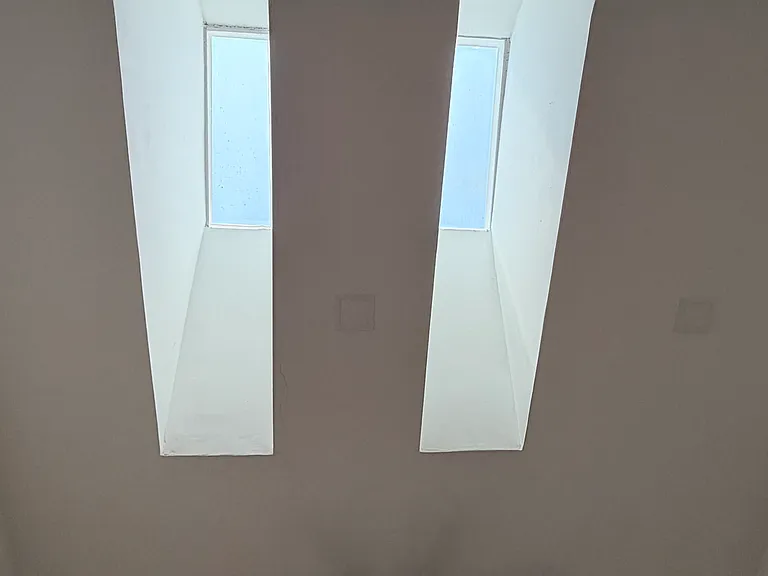 Living Room features 2 skylights in addition to the massive 17ft ceilings