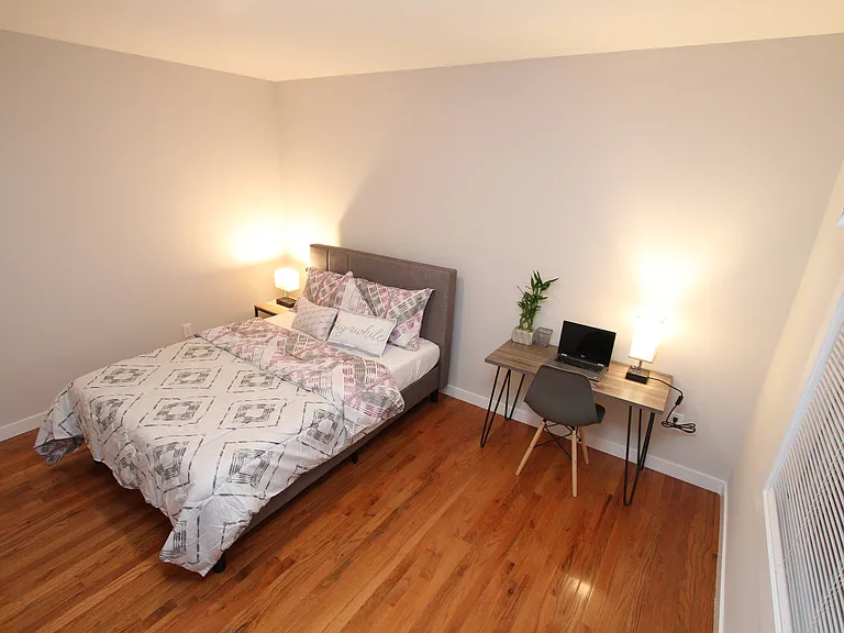Generously sized bedroom with space for a home office