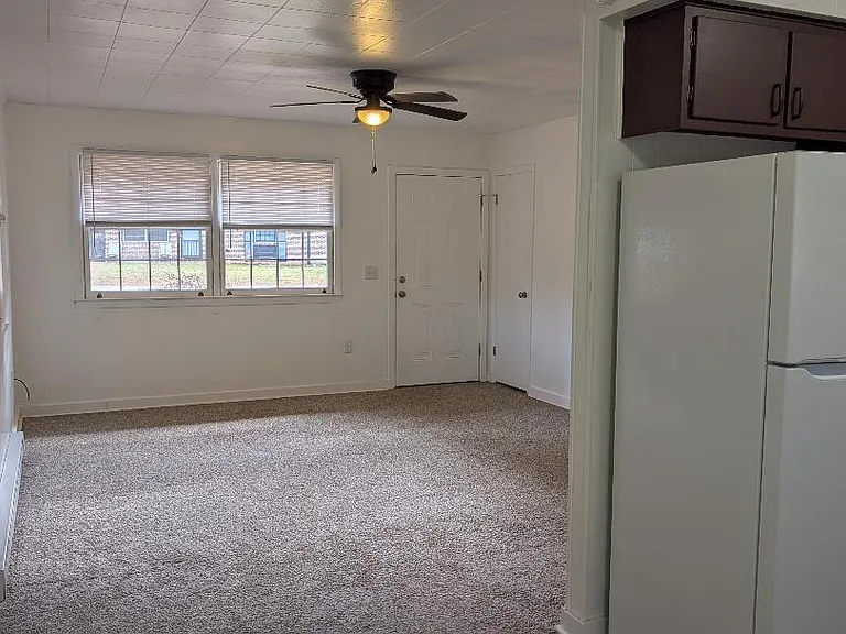 ANOTHER VIEW FROM THE KITCHEN INTO THE LIVING ROOM. PHOTO WAS TAKEN WHERE THERE IS ROOM FOR A DINING TABLE