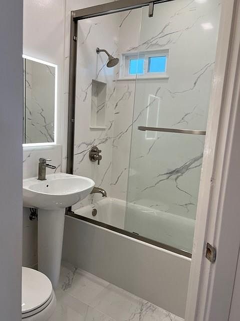 Remodeled bathroom with quartz surround