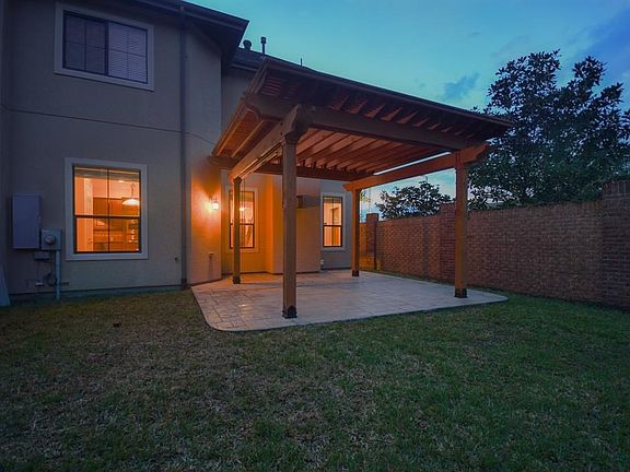 One of the best features of the home is this incredible pergola with 3 sides of roll down wind & sun sheers. The pergola is covered so never worry about being outside when it rains. This is a wonderful place to spend an evening grilling.