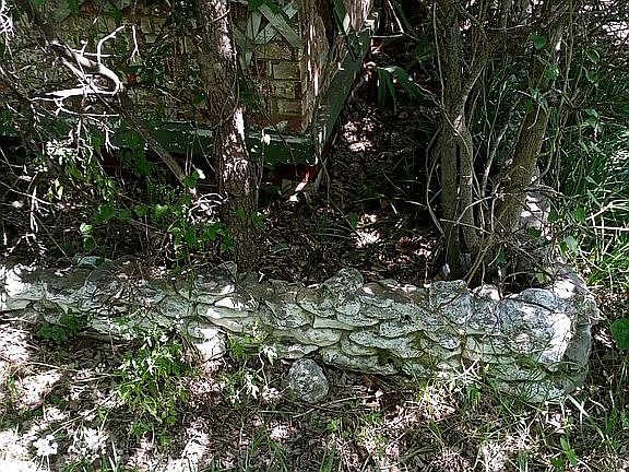 Full rock flower beds front por