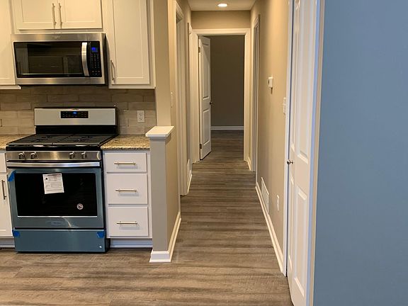 Hallway leading to bedrooms and bathrooms