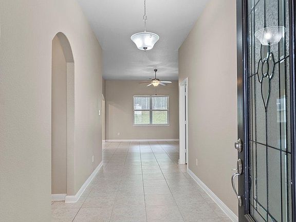 A light and bright entryway featuring ceramic tile flooring greets you as you enter.