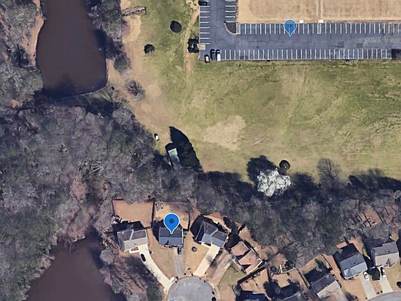 Home is on large cul-de-sac, backs up to woods and Lebanon Baptist Church, and is close to two ponds.