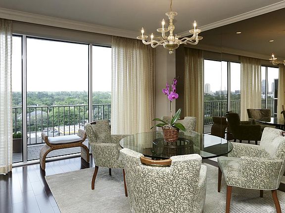 Murano glass chandelier, mirrored wall and spectacular views in the dining area.
