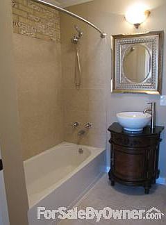 Master bath
						:
						Master bath boasts new tile surround , vanity , tile floor.
