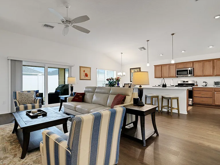 The Living Room Area with a View of the Kitchen and Dining Area.