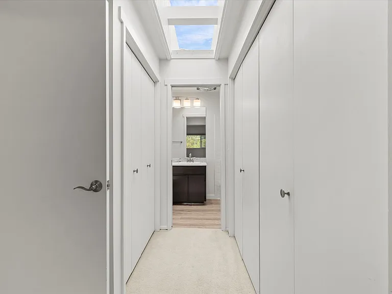 Large closets both sides of hall to ensuite