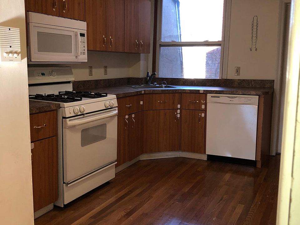 Kitchen with Microwave, Range Stove, and Dishwasher. Large w