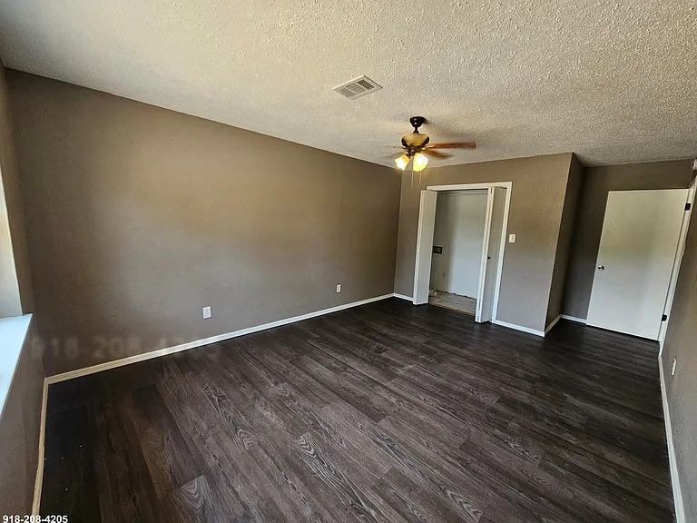 Primary bedroom with laundry hookups in closet