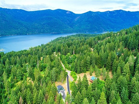 Beautiful cedar sided home resting on a shy acre, above Lake Cle Elum. Backing thousands of acres of Central Cascades Forest.