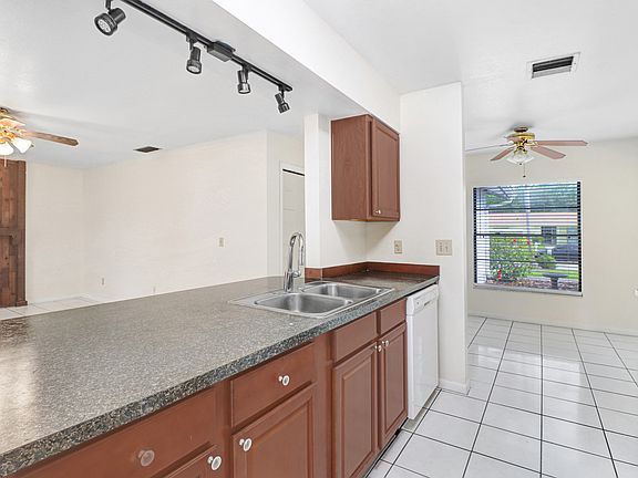 Kitchen over looks the family room with an eat-in kitchen to one side and dining room to the other side