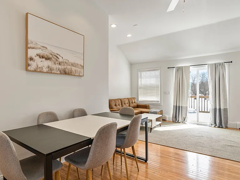 Sliding Glass Door Private Balcony/Deck Access Recessed Lighting Neutral Paint Spacious Layout Modern Window Treatments