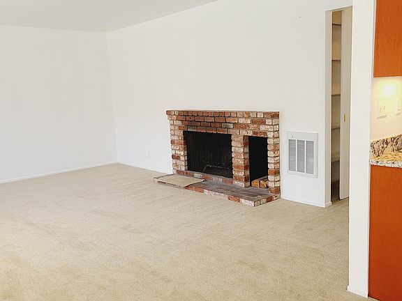 View of Living Room & Fireplace from Dining Room