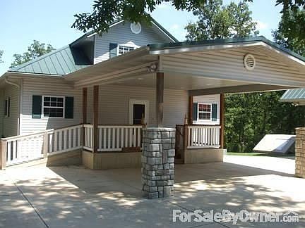 Porte-cochere : Room for 2 vehicles, complete with a beautiful wood deck and handicap ramp.
