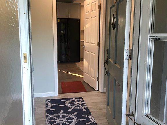 Through the home entry door and foyer directly into your private suite. The shared laundry room is located to the right.