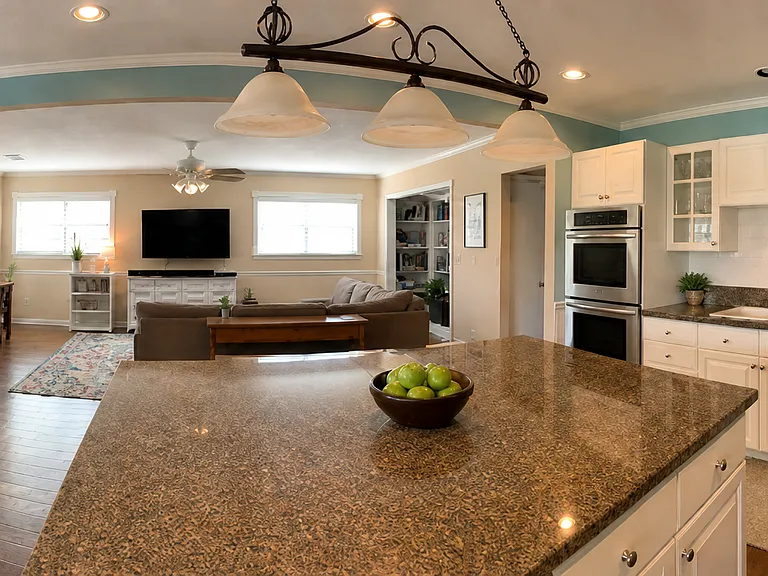 Kitchen opens to living room