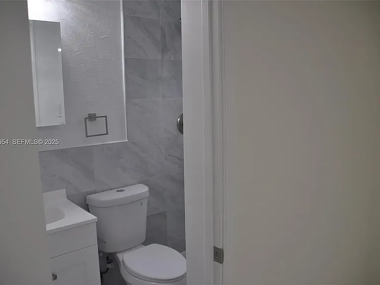 571 NE 61st St — Photo 35