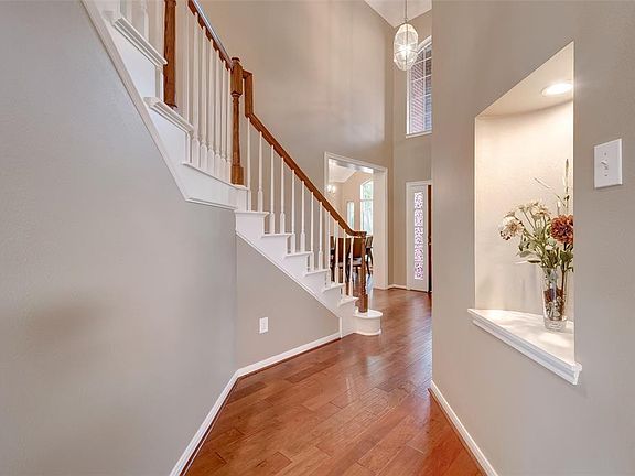 Another view of the entrance and staircase. Notice the architectural niche, the perfect place to show off your favorite home accents.