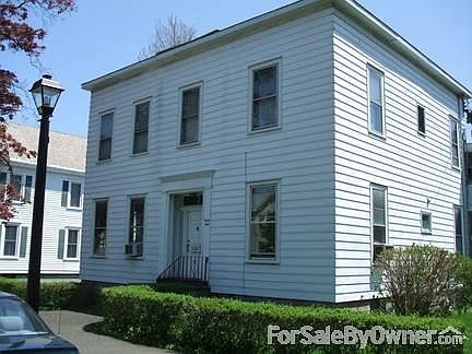 1st St main entrance
						:
						Double landscaped lot with circular driveway around building
