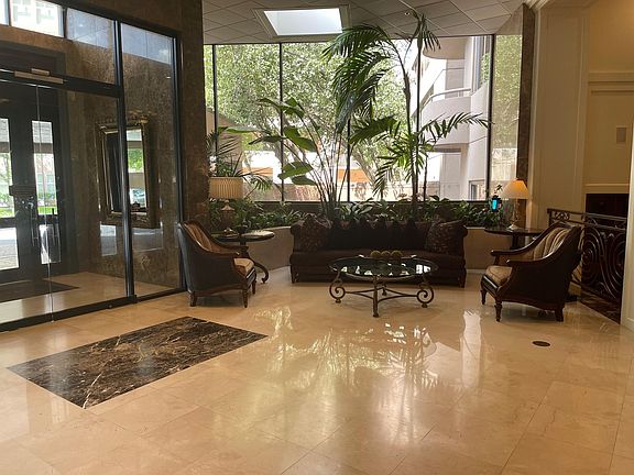 Lobby seating with lush landscaping