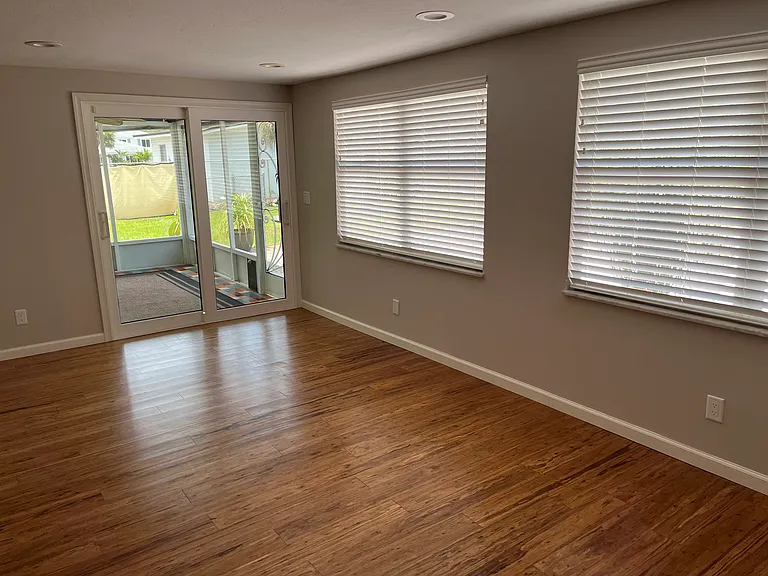 family room with access to screened lanai