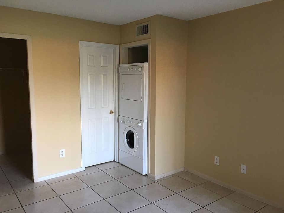Tile floor and in unit washer and dryer.