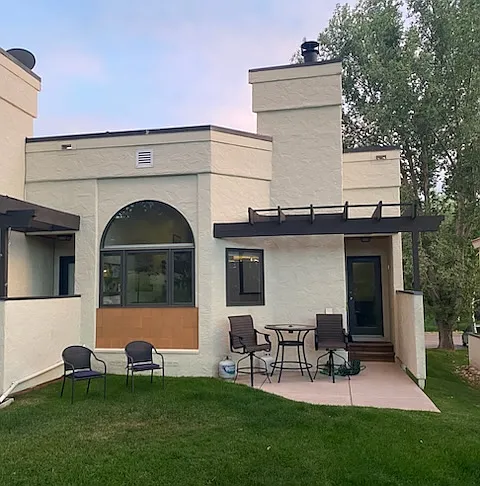 Backyard and patio that opens onto golf course available for walks, hikes, snowshoeing, with or without dog!