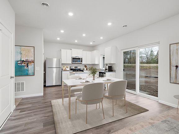 The kitchen opens up to a dining area.